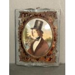 A miniature portrait of a young man in a lead frame with brass and tortoiseshell inlay
