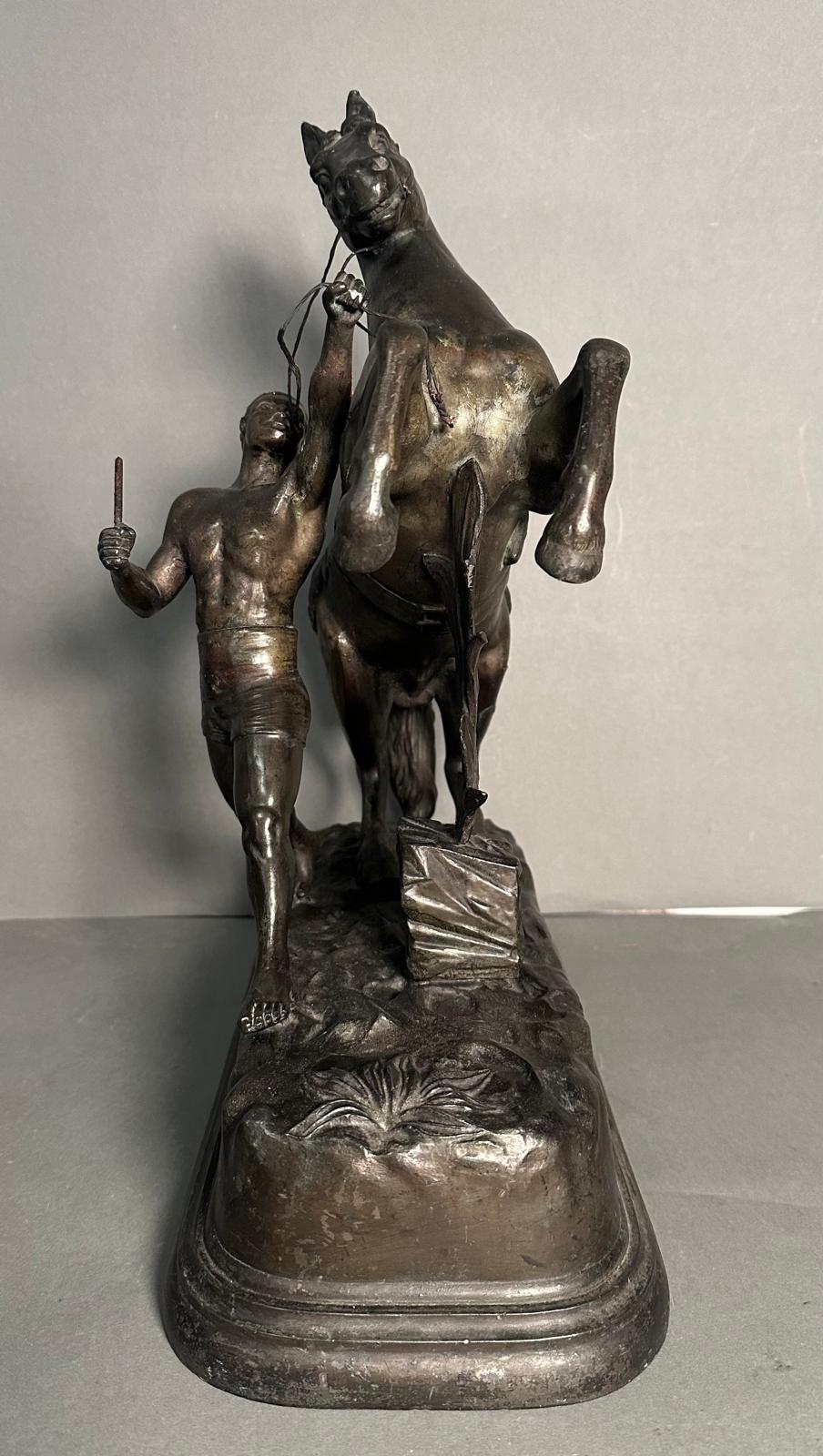 A pair of metal sculpture of tribal figures wrangling rearing horses Height approximately 40cm - Image 5 of 5