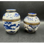 Two blue and white crackle glazed Chinese lidded pots, marked to base