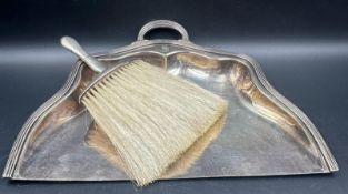 A Reed Barton EPNS crumb tray along with a hallmarked silver brush by Boots Pure Drug Company
