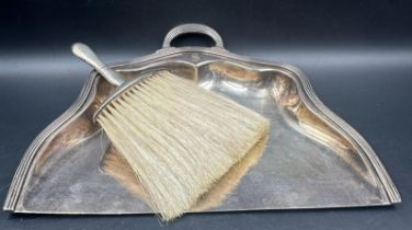 A Reed Barton EPNS crumb tray along with a hallmarked silver brush by Boots Pure Drug Company