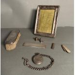 A selection of silver items and curios to include, picture frame AF, dressing table brush, locket,