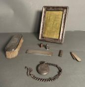 A selection of silver items and curios to include, picture frame AF, dressing table brush, locket,