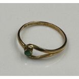 A 9ct gold ring with emerald style stone, approximate weight 1.1g Size P
