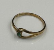 A 9ct gold ring with emerald style stone, approximate weight 1.1g Size P