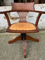 An oak revolving desk chair