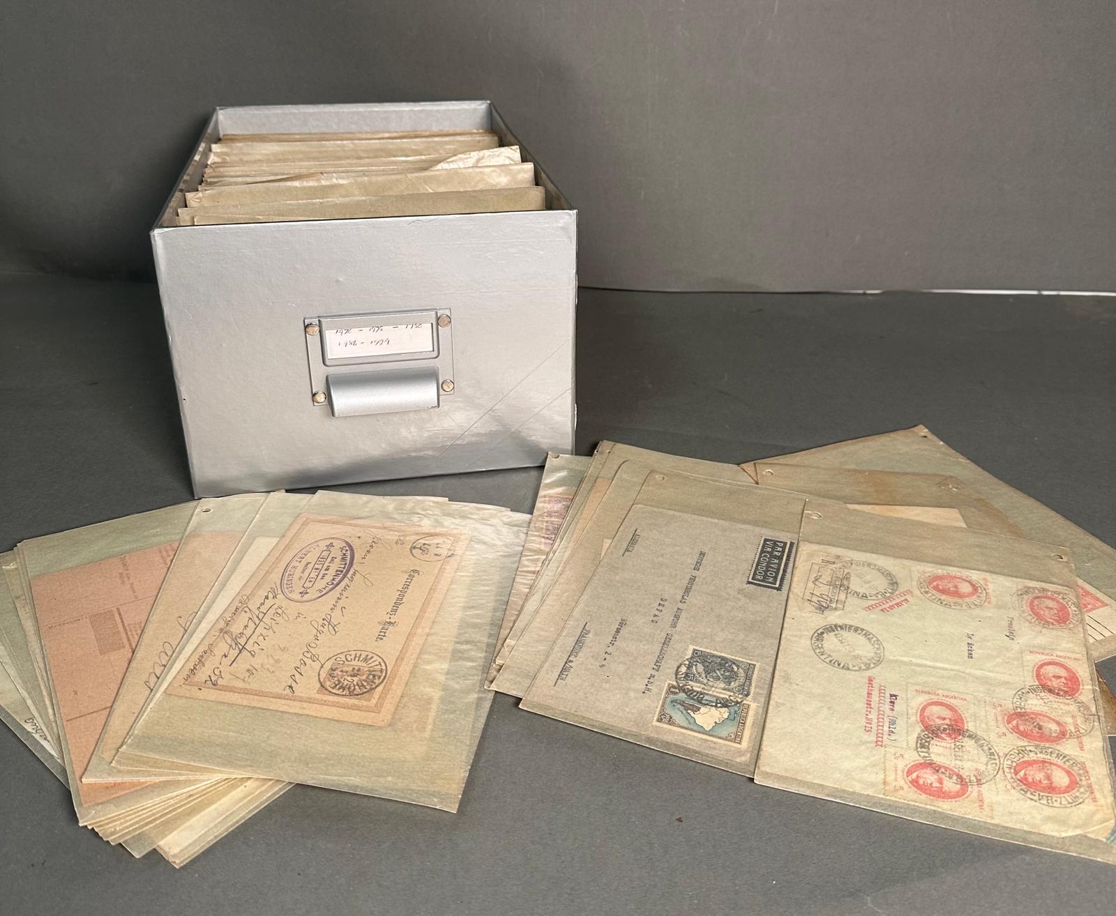 A Box containing individually wrapped posted envelopes with stamps from across the world including