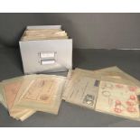 A Box containing individually wrapped posted envelopes with stamps from across the world including