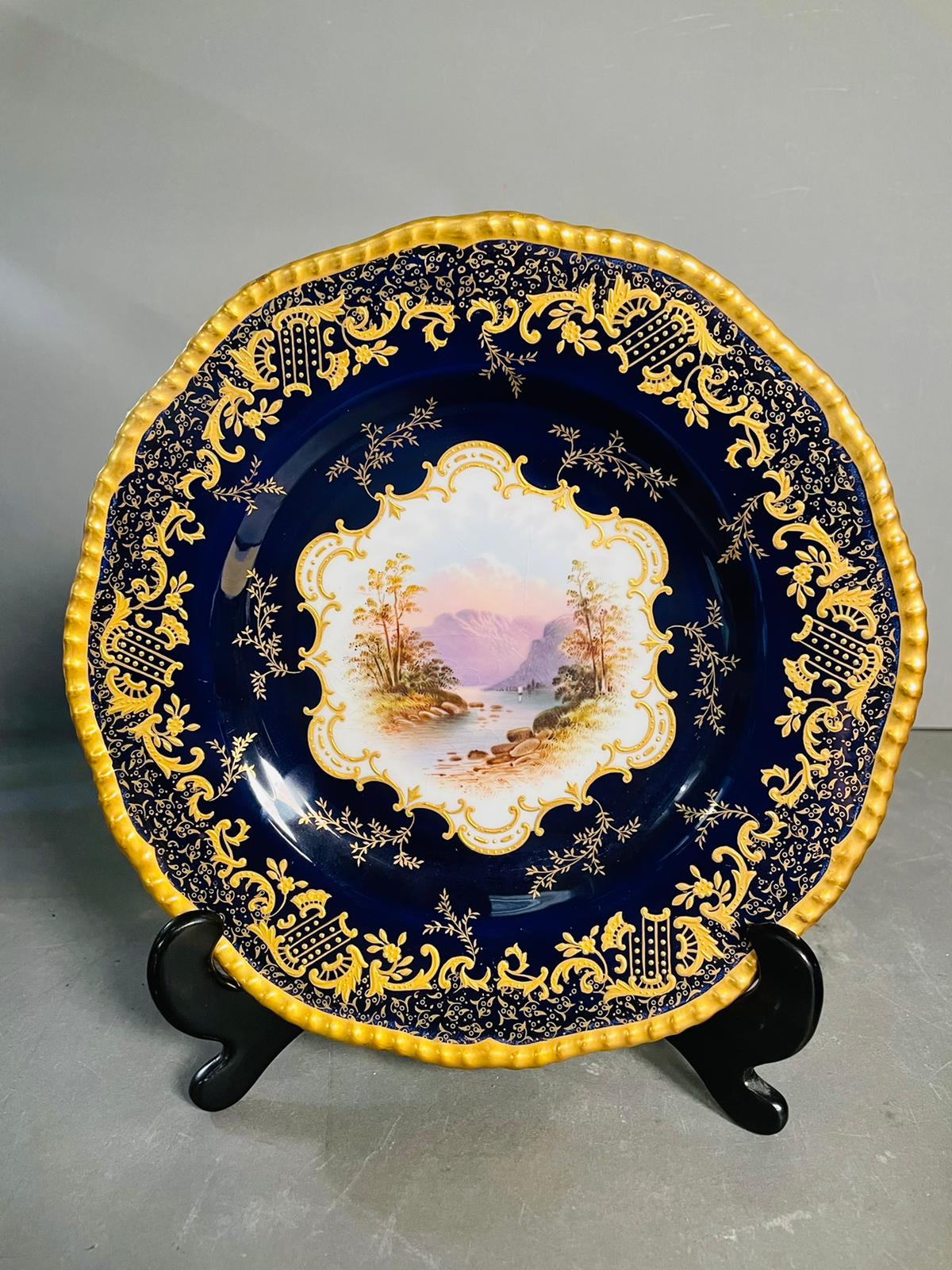A selection of five early 20th century Coalport hand painted plates with blue grounds, under an acid - Image 10 of 12