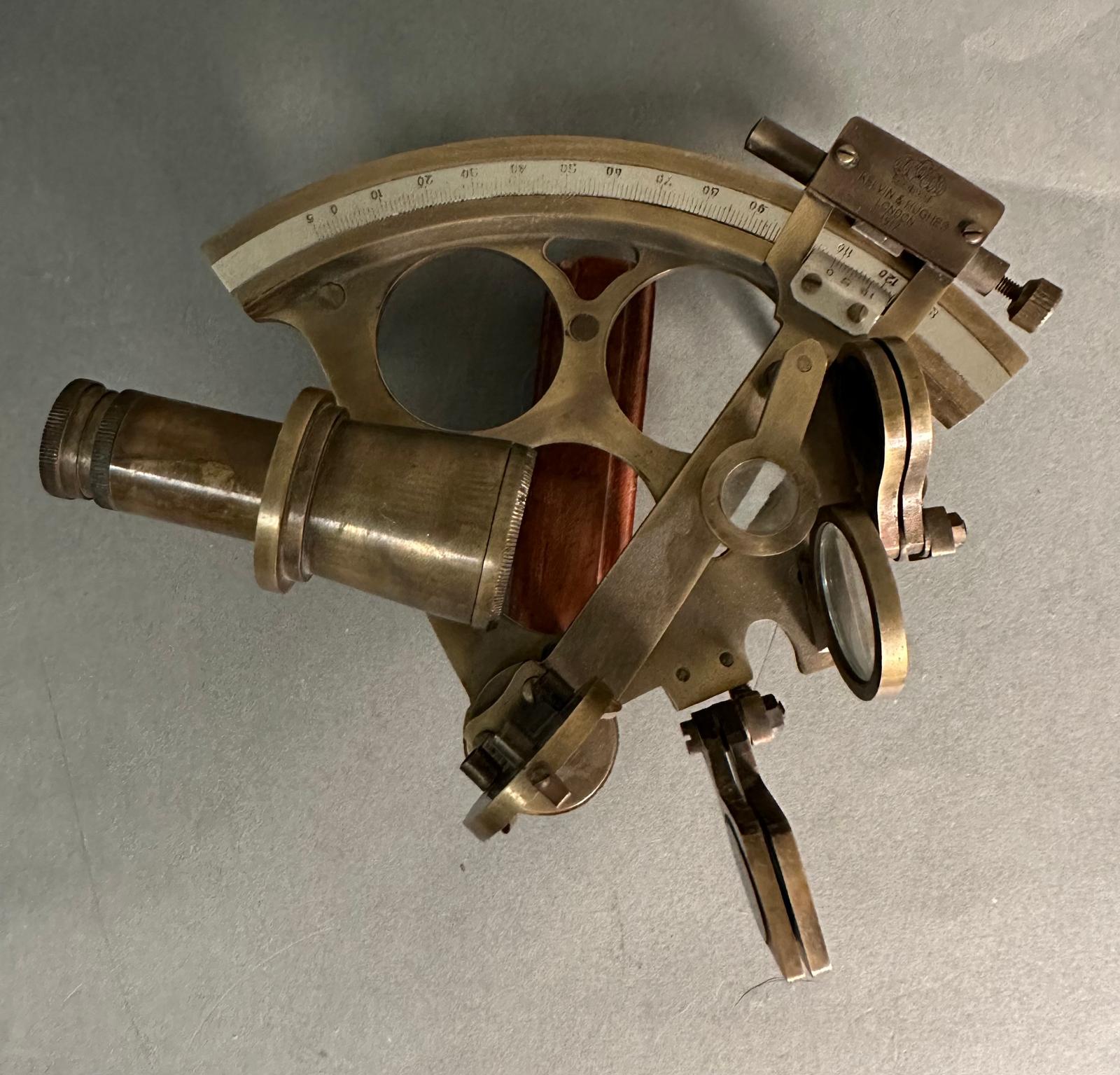 A vintage brass sextant by Kelvin and Hughs on London stamped 1917
