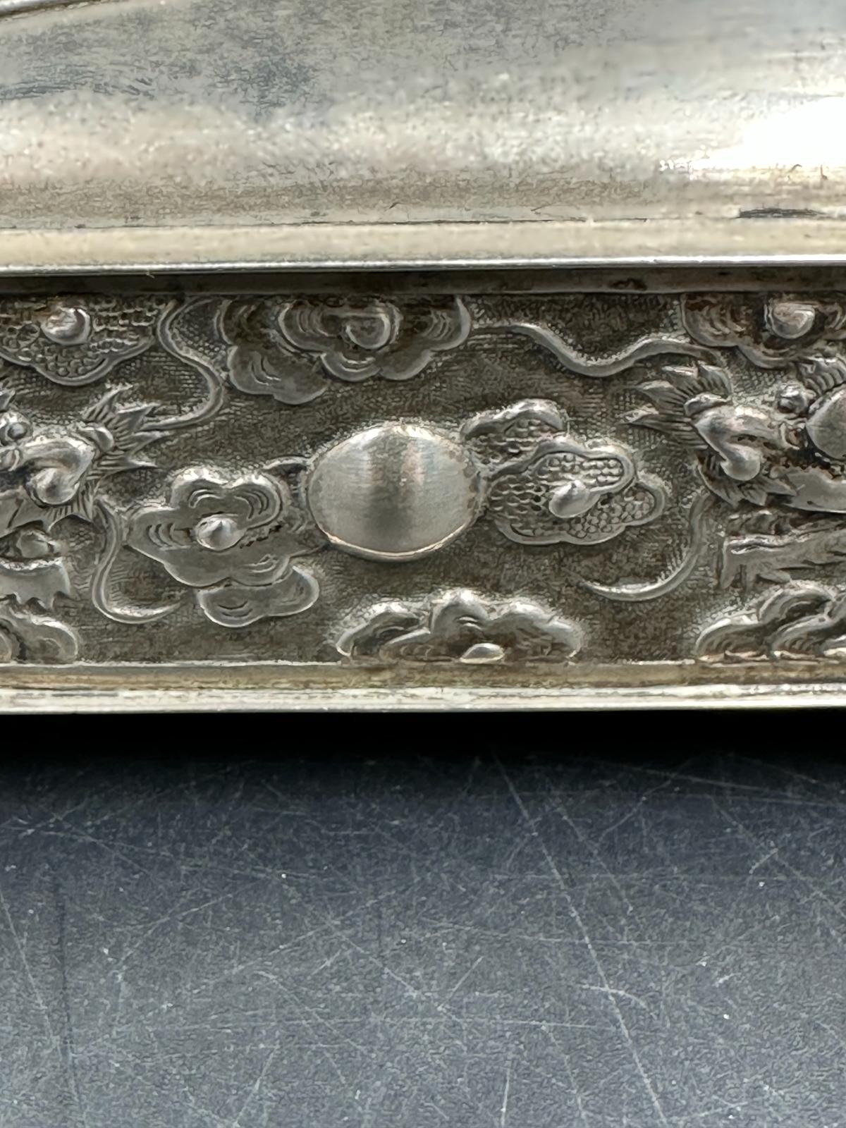 A Chinese silver hairpin or hat pin box decorated with dragons and on four small feet, makers mark - Image 2 of 4