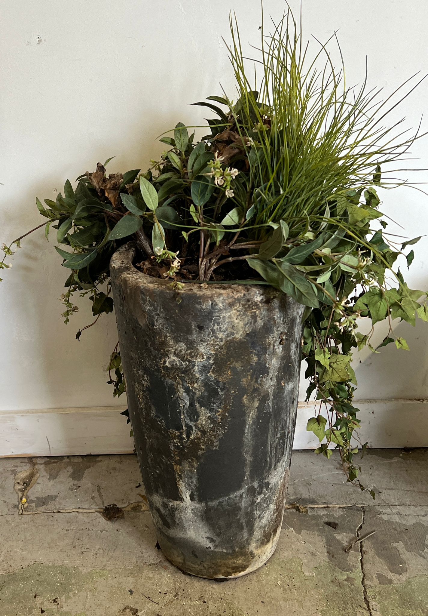 A planter with faux plants (H58cm)