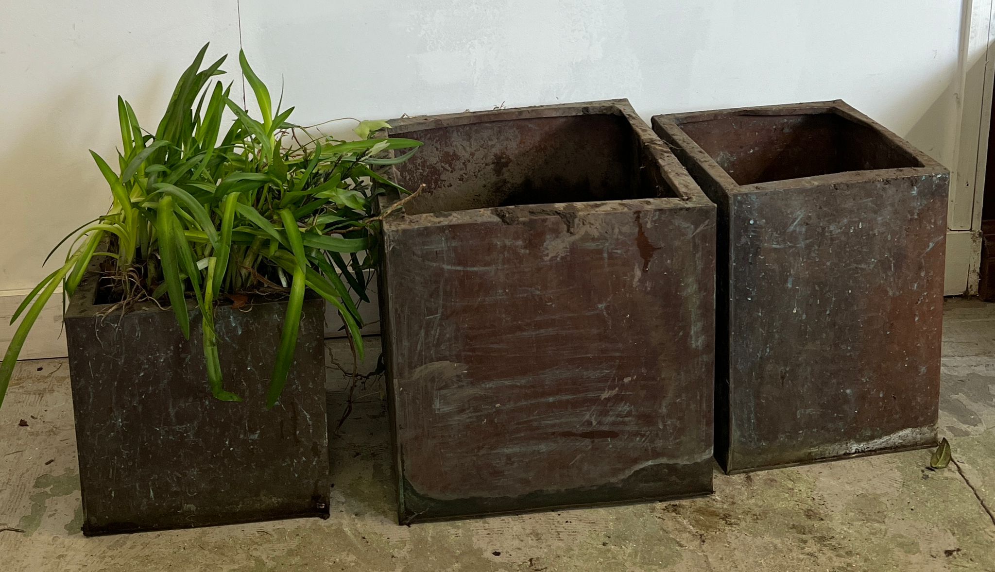 Three square copper planters (Largest H40cm SQ40cm, smallest H31cm SQ31cm)