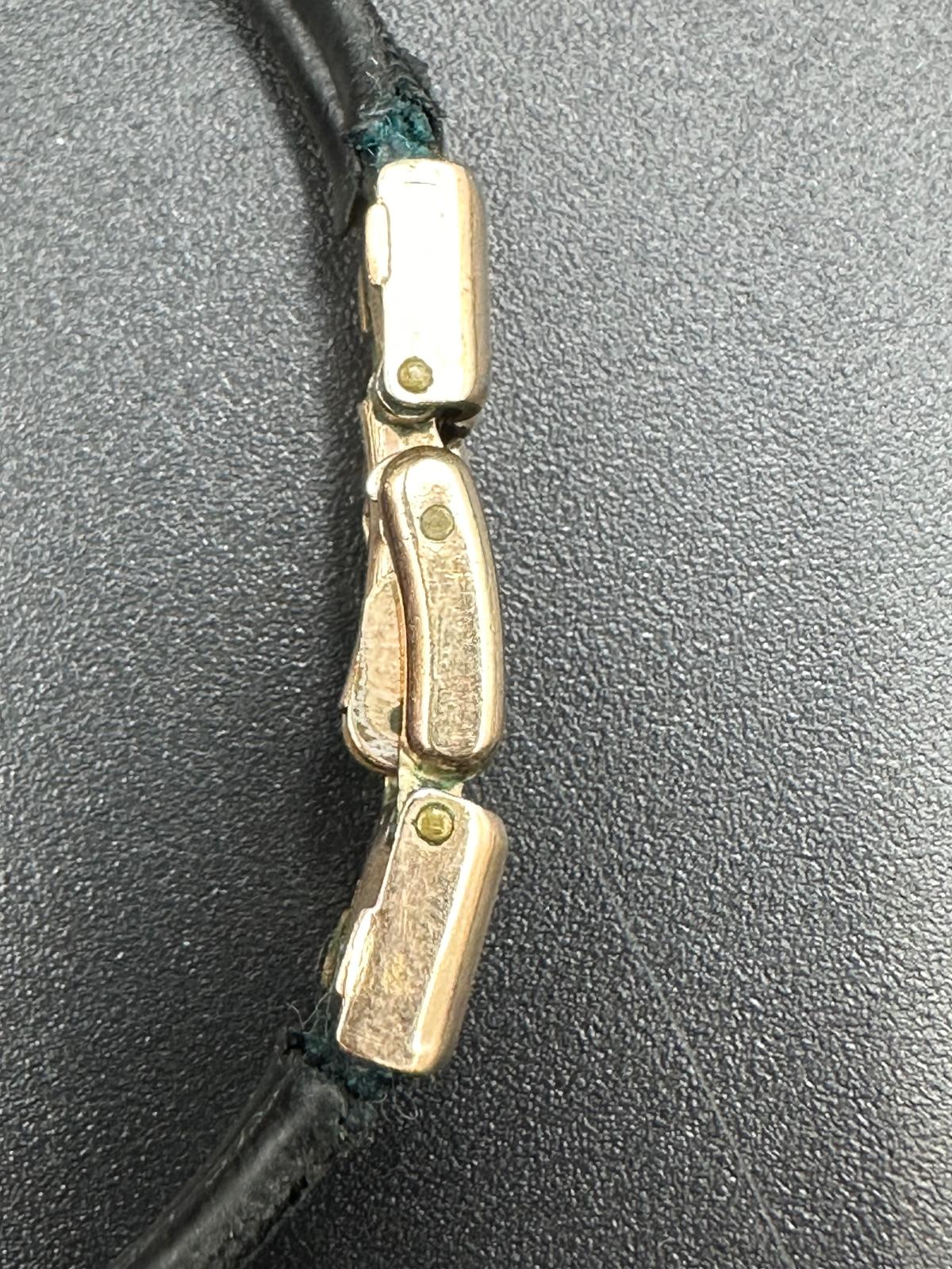 A rare ladies Omega gold watch on leather bracelet with image of a Sheik's head. - Image 3 of 4