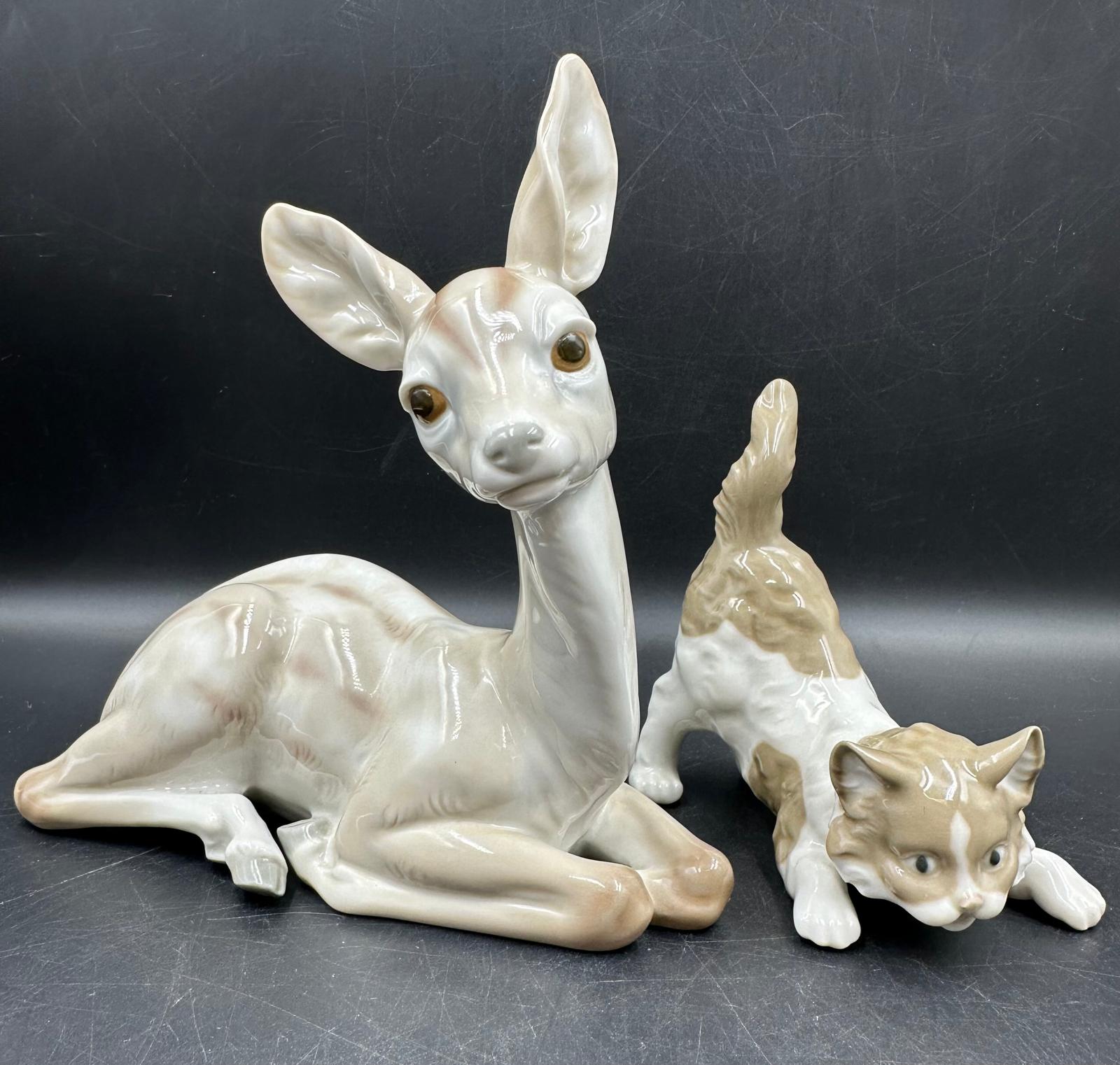 Two Lladro figures Sitting Deer No 1064 and playful cat Number 5091