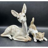 Two Lladro figures Sitting Deer No 1064 and playful cat Number 5091