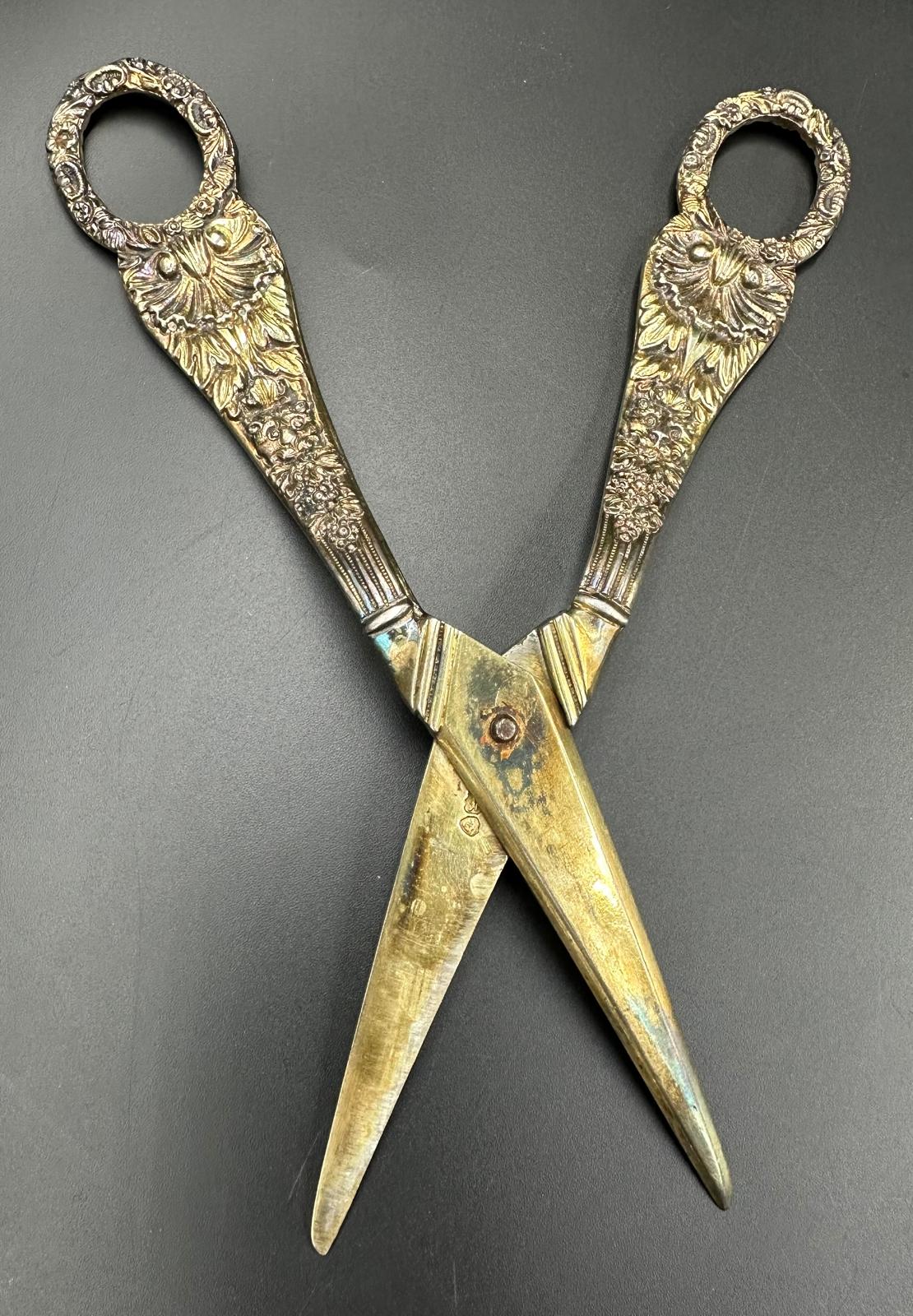 A pair of silver grape scissors, with a total weight of 131g and floriate design hallmarked for - Image 2 of 3