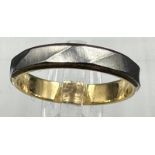 An 18ct yellow gold and platinum wedding band style ring approximate weight 2.7g and size K.