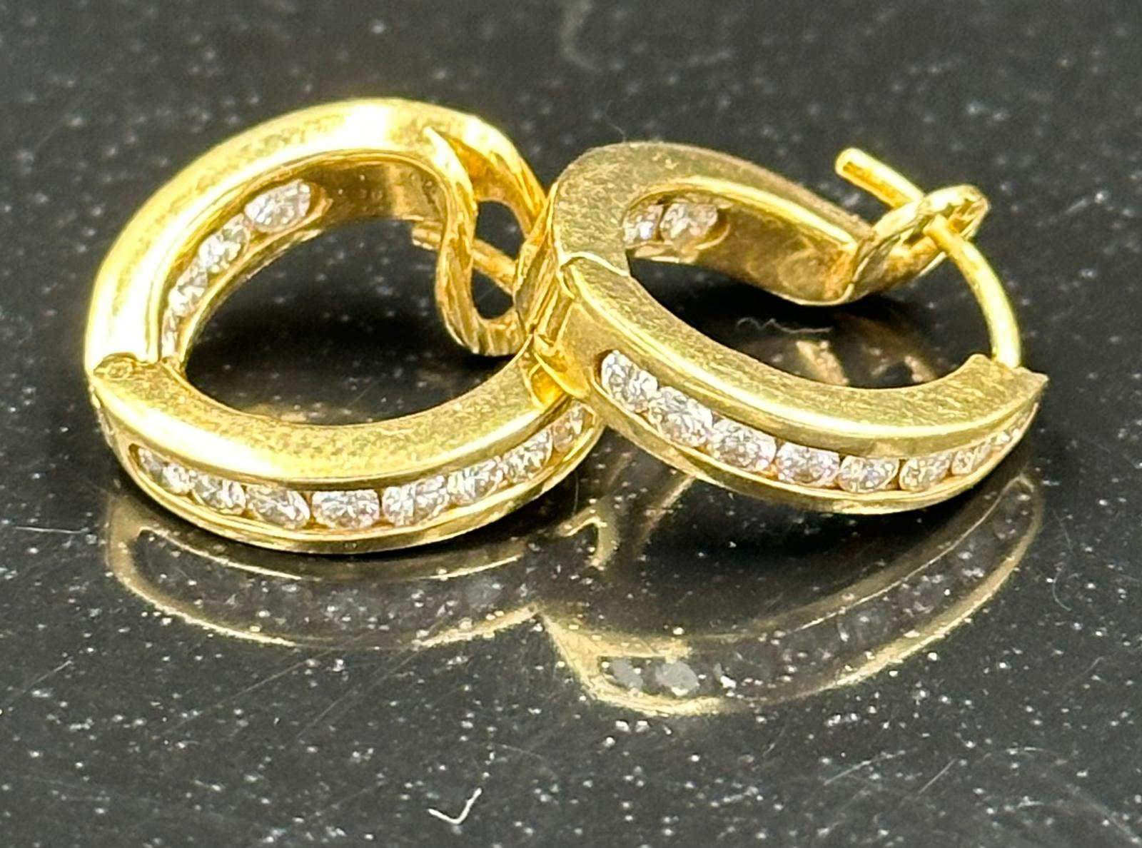 A Gold diamond hoop earrings mounted in 18ct gold. Signed T&Co. Total diamond weight approximately - Image 3 of 3