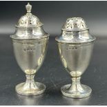 A pair of silver cruets by Samuel Walton Smith, hallmarked for Birmingham 1890