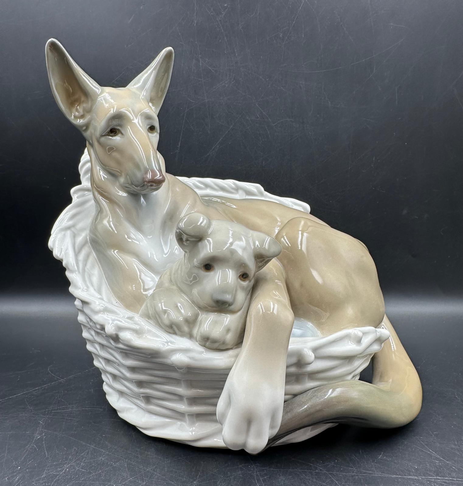 A Lladro figure of a German Shepherd with puppy number 4731