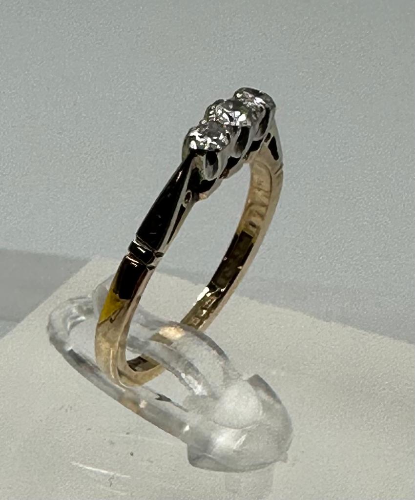 A 9ct gold and platinum three stone diamond ring, size L. - Image 5 of 6