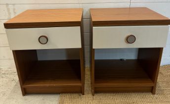 A pair of contemporary single drawer bedside tables with white drawers and wood effects tops (