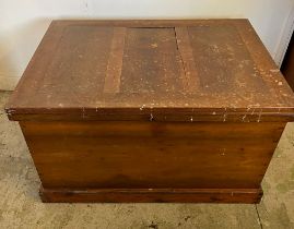 A large pine panelled blanket box or chest with brass drop handles to sides (H70cm W109cm D73cm)