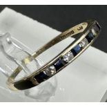 A 9ct gold diamond and sapphire ring, approximate size R.