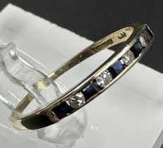 A 9ct gold diamond and sapphire ring, approximate size R.