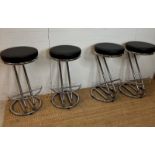 Four black faux leather bar stools on chrome bases (H69cm)