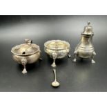 A silver cruet set to include, pepper, salt and mustard pot on hoof feet by J B Chatterley & Sons