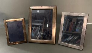 Three silver photograph frames marked 925 (Largest 17cm x 22cm)