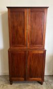 A George IV mahogany bookcase cabinet (Base H96cm W88cm D36cm Top H91cm W89cm D27cm)