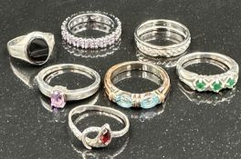 A selection of seven silver fashion rings, various styles and finishes