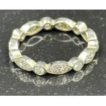 Diamond eternity ring mounted in platinum. Signed T&C 950. Total diamond weight approximately