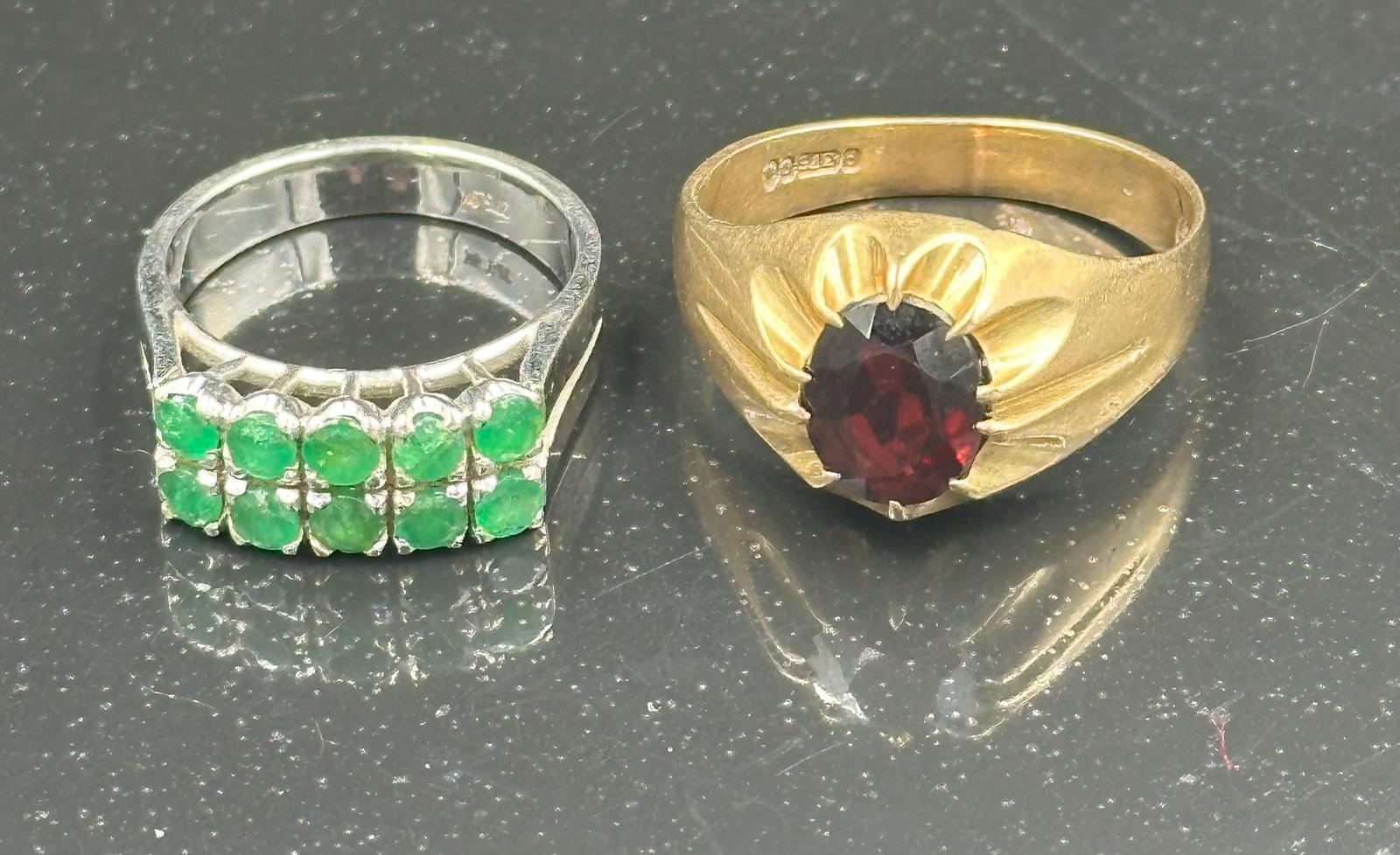 Two 9ct gold fashion rings one with green stnes in two lines on white gold the other a signet ring