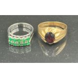 Two 9ct gold fashion rings one with green stnes in two lines on white gold the other a signet ring