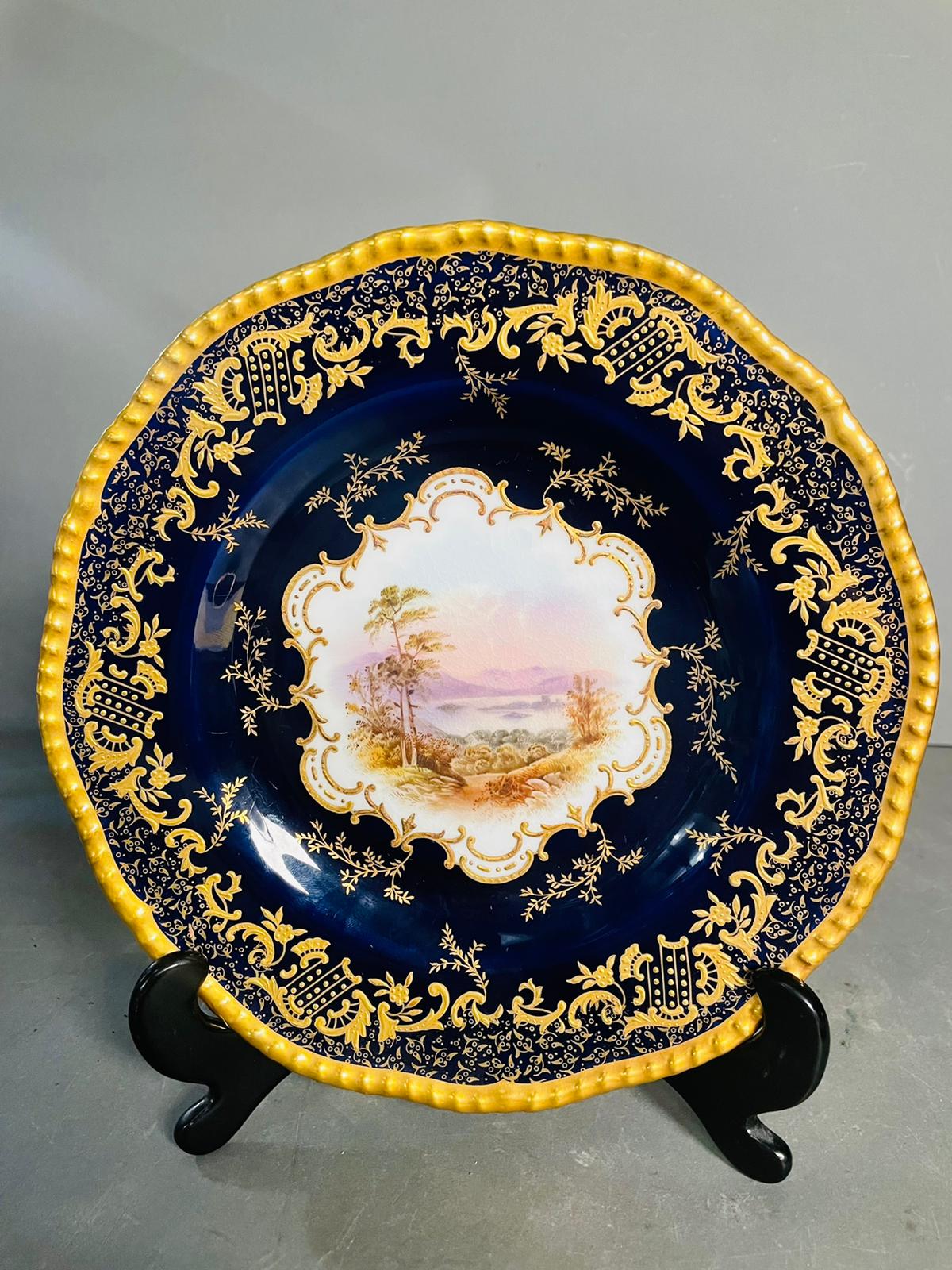 A selection of five early 20th century Coalport hand painted plates with blue grounds, under an acid - Image 6 of 12