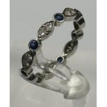 Sapphire and round diamond eternity ring mounted in platinum. Signed T&C 950. Total diamond weight