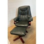 A green leather upholstered reclining arm chair and matching foot stool