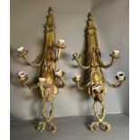 A pair of brass Louis XVI style five arm wall sconces