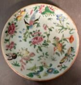 A Chinese Canton celadon ground and famile rose plate