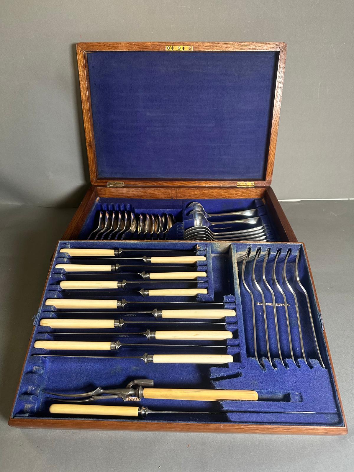 A six place setting canteen of cutlery with bone handles, knives have silver collars by William