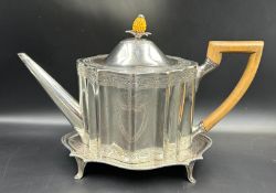 A Georgian silver teapot on stand, hallmarked for Edinburgh 1816 with a makers mark of AS, with a