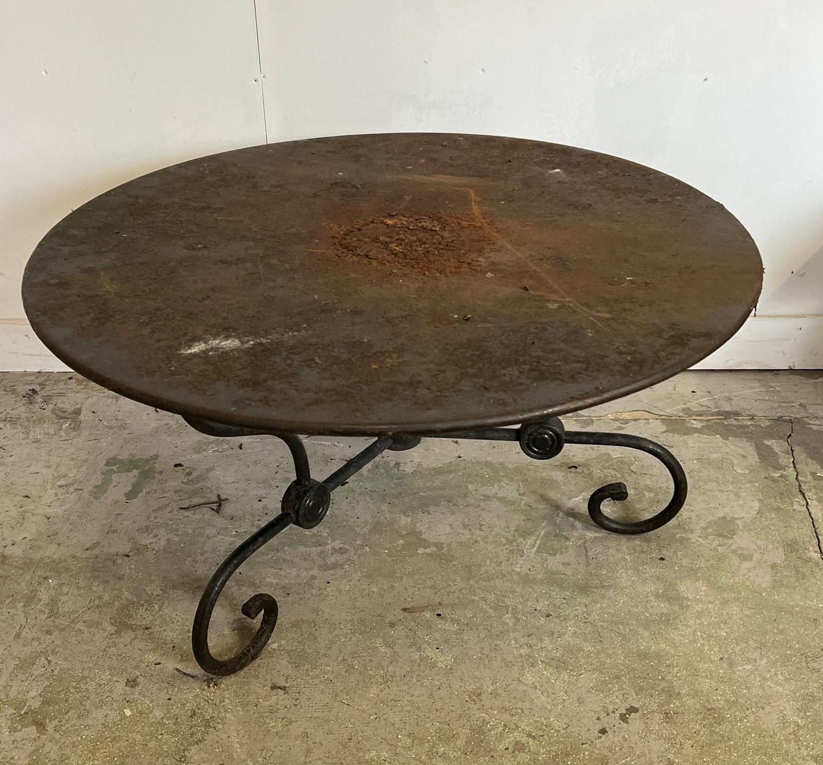 A French style round decorative garden table with scrolling iron work legs (H54cm Dia100cm)