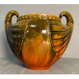 A large glazed pottery jardiniere by Christopher dresser for Bretby