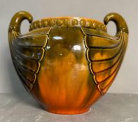 A large glazed pottery jardiniere by Christopher dresser for Bretby
