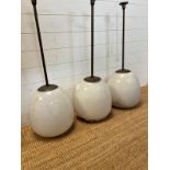 Three industrial 1930's pendant ceiling lights with opaline glass tulip shades by General Electric