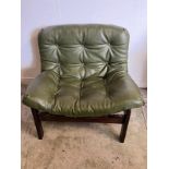A Mid Century Easy chair with leather button back chair in the style of Arne Norell Condition Report